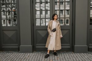 Easy Ways to Wear More Colorful Clothes Every Day A simple fall outfit with a single colorful accessory against neutral clothing