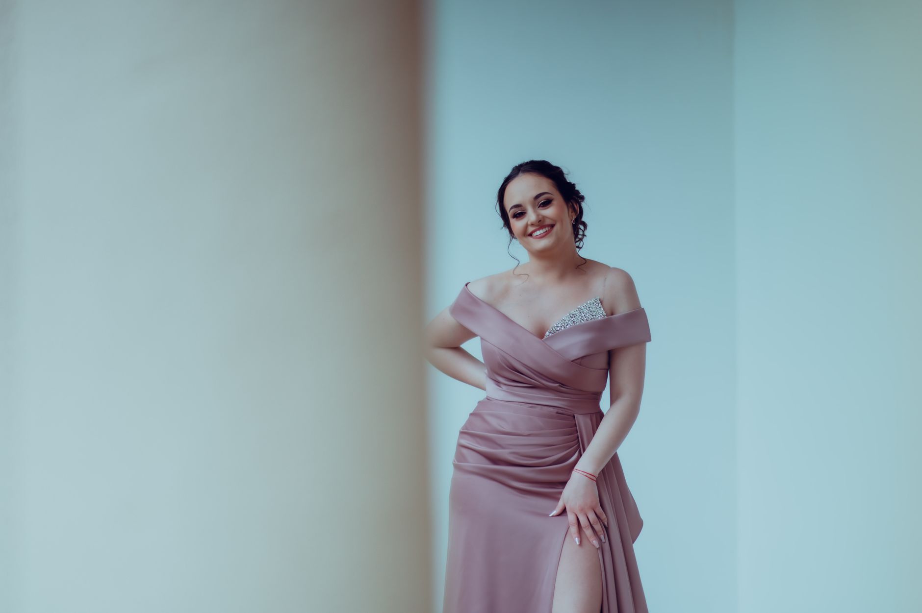 Woman in a long formal gown suitable for a black-tie fall wedding