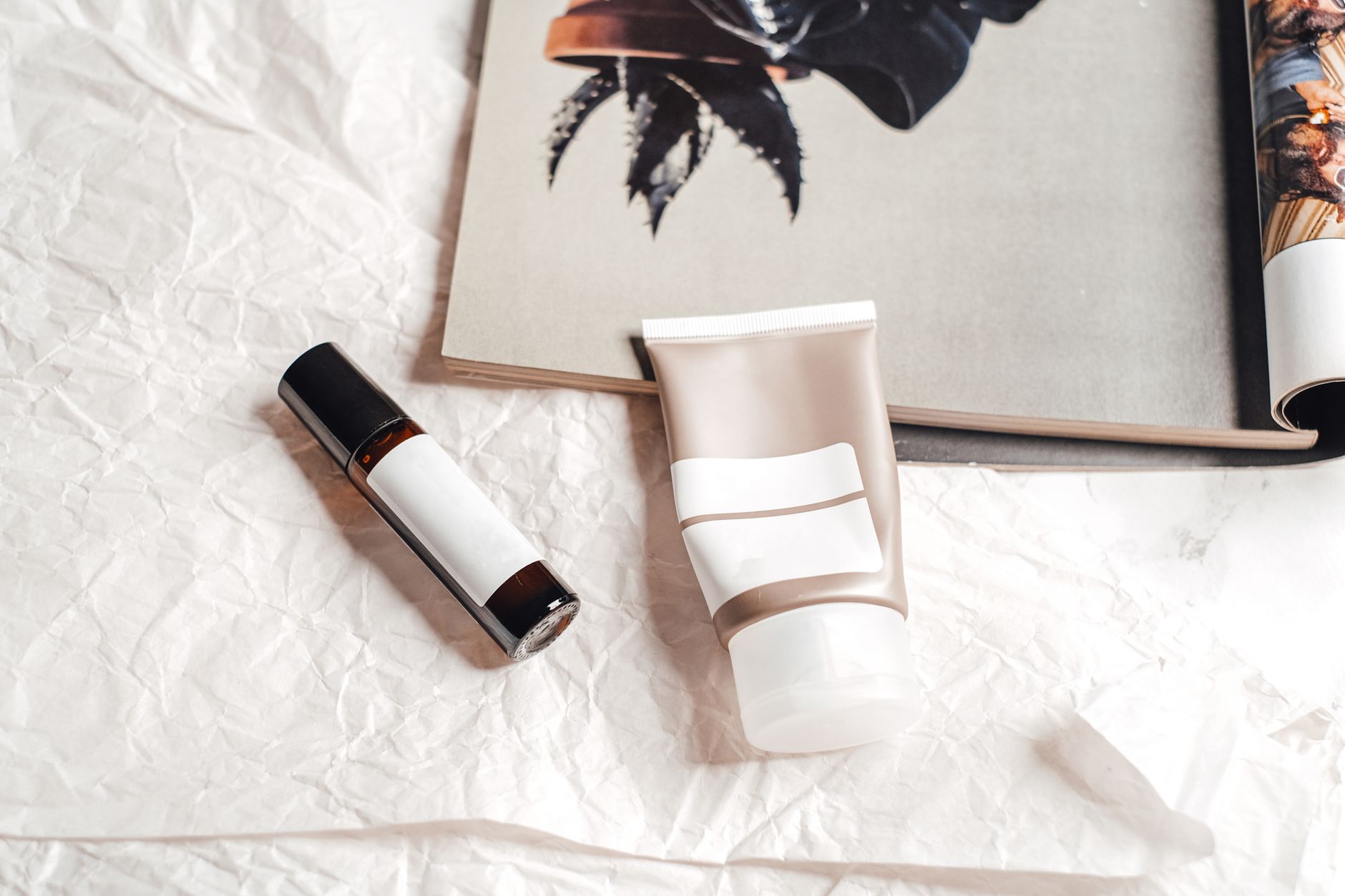 Assorted skincare and beauty products laid out on a flat surface
