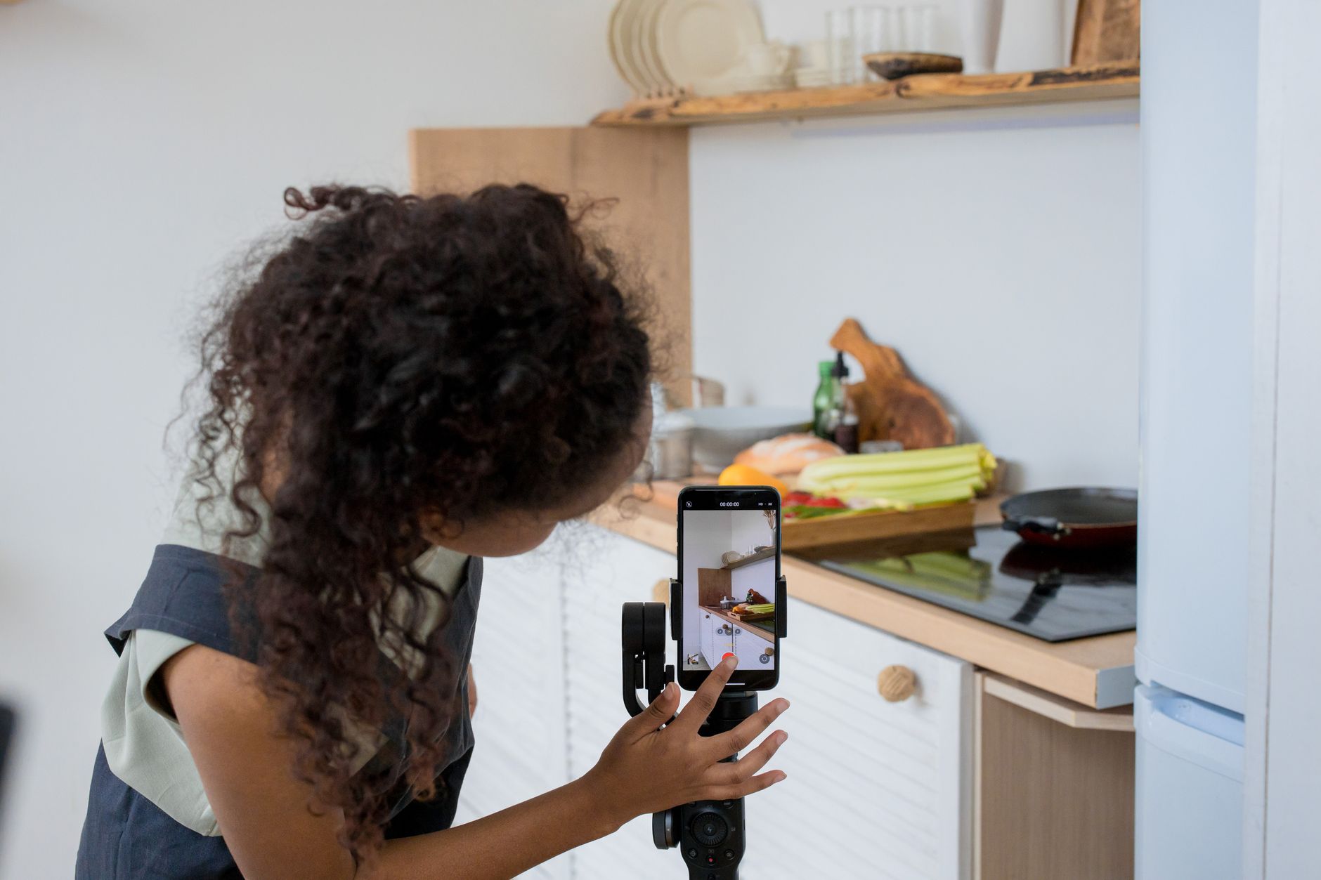 A content creator recording video commentary on a smartphone