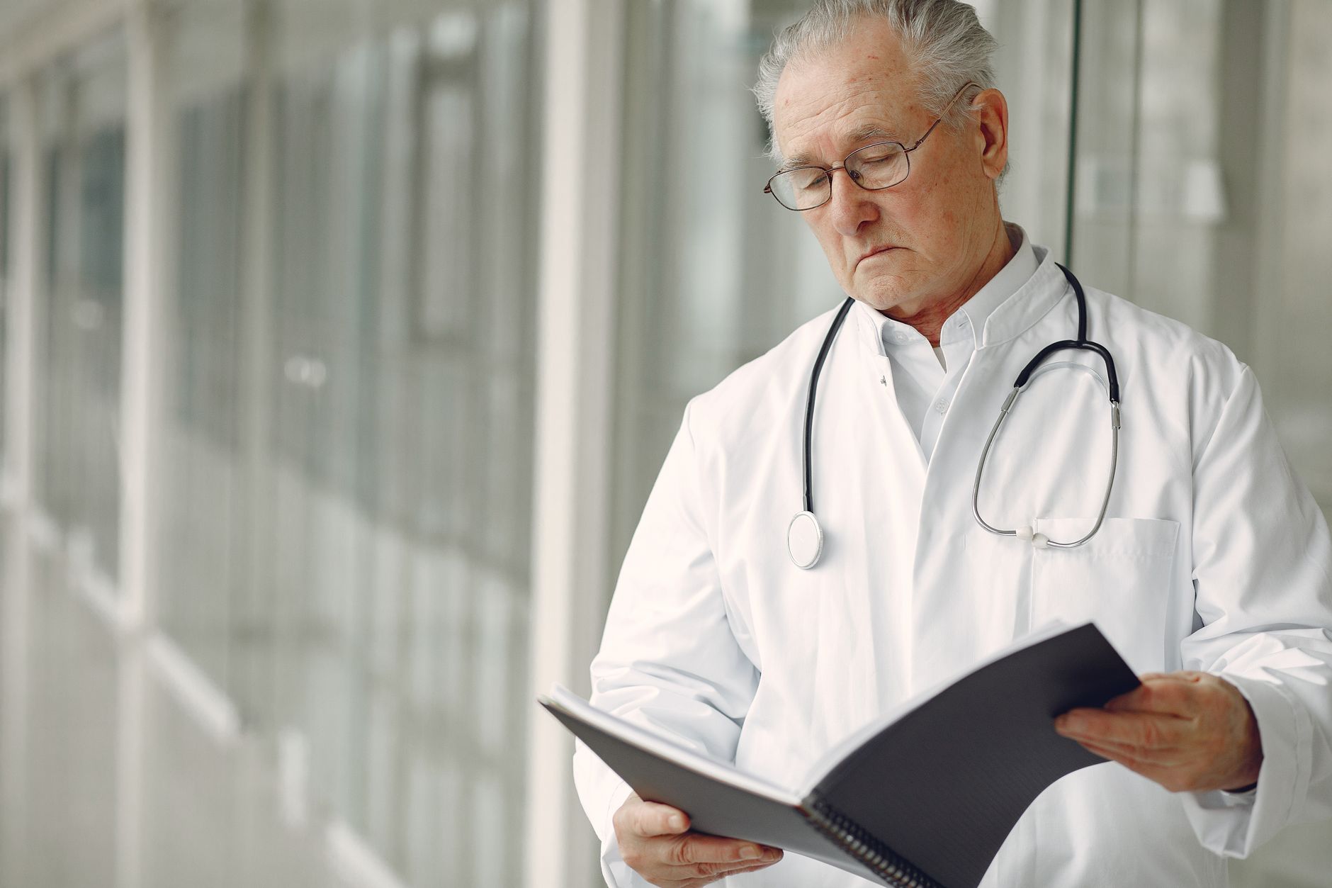 Medical professional speaking with a patient during a clinical consultation