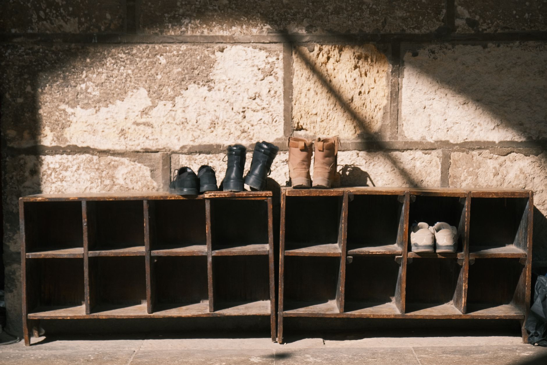Leather boots with cedar shoe trees on a shelf