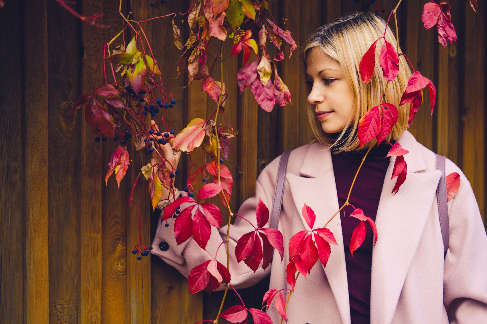 Fall fashion look featuring layered soft silhouettes in deep autumnal colors