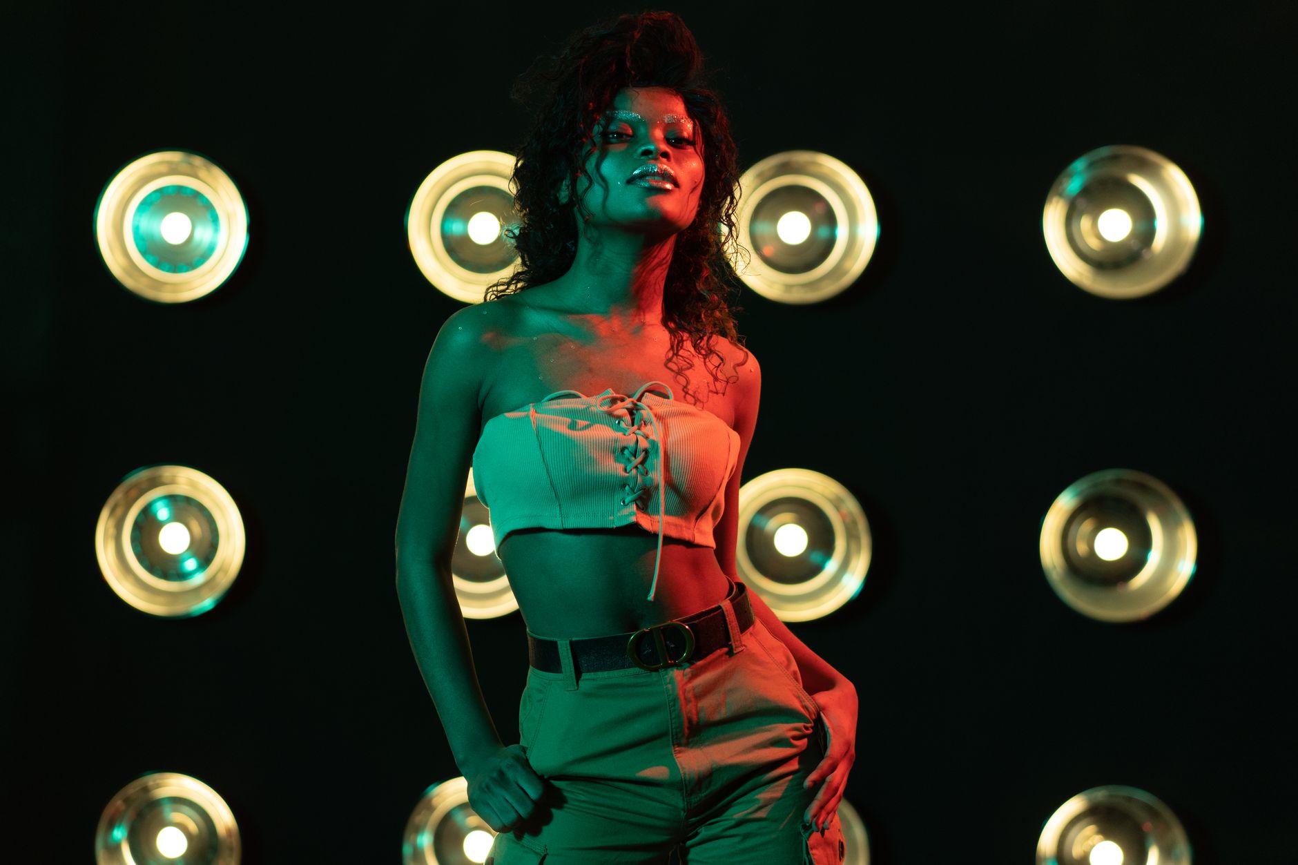 Bright stage lights illuminating a fashion show runway