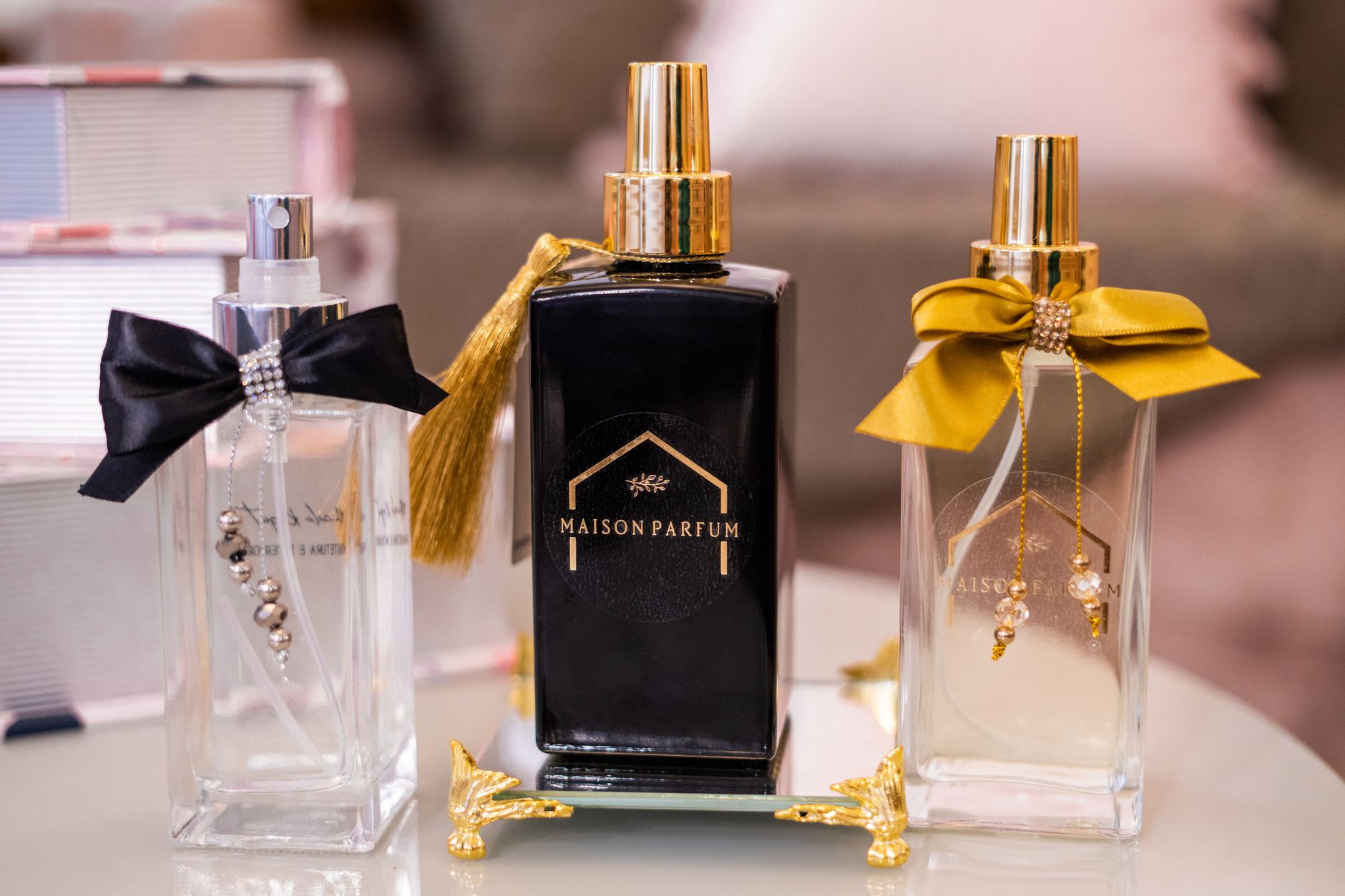 Collection of small perfume mist bottles arranged together on a white background