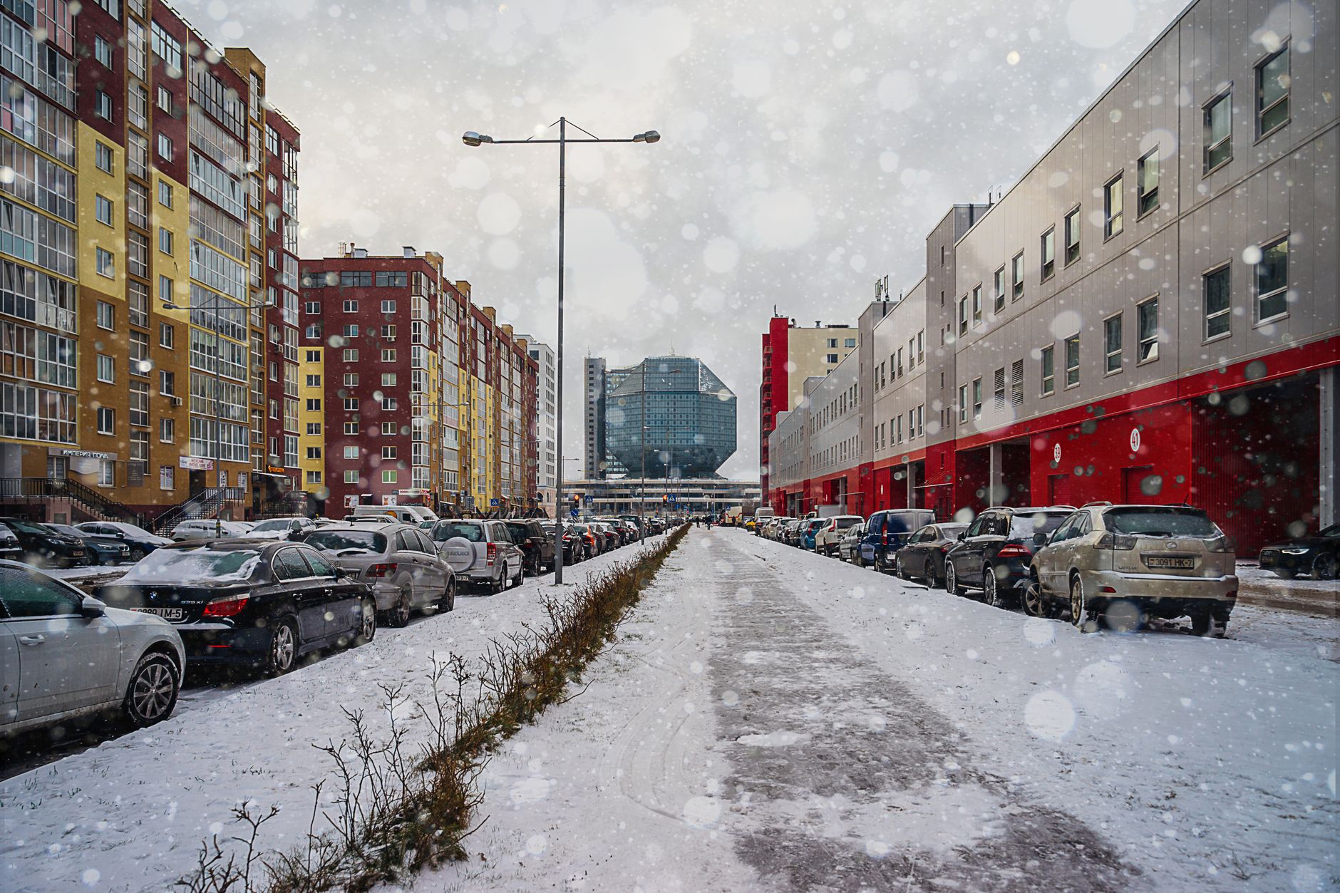 Person walking alone on an empty urban street in winter