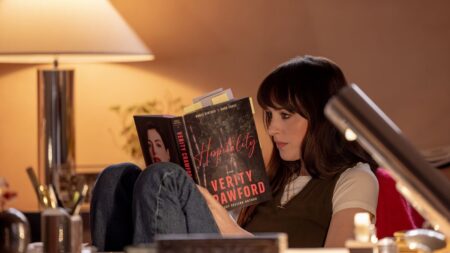 Dakota Johnson’s Stylish Wardrobe from the Film Verity Warm, dimly lit cottage interior with neutral tones and natural textures