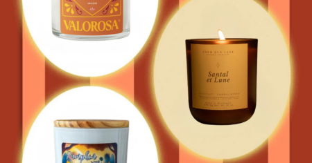 Latine-Owned Candles Doing Fall Better Than the Season Itself Warm living room interior with candles lit on a wooden table in autumn