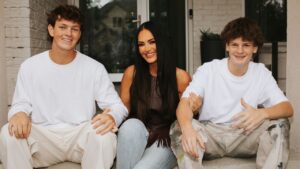 A mother spending time with her two young sons at home