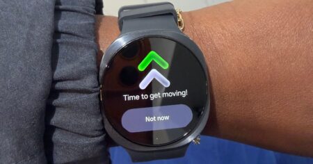 Person wearing a slim smartwatch on their wrist during daily activity
