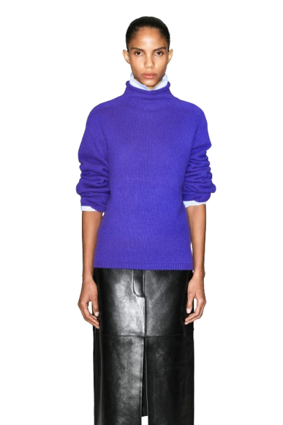 Colorful sweaters displayed on retail shelving with purple prominently featured